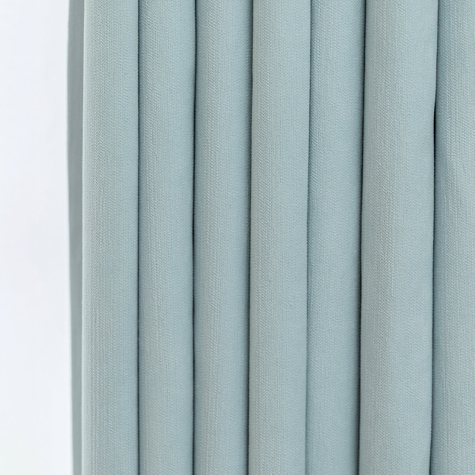 Pale blue chenille fabric texture with vertical pleats for custom blackout curtains