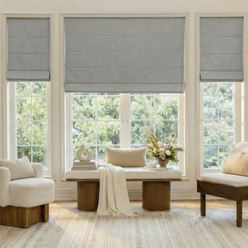 Alder custom grey faux linen blackout Roman shade for window treatments.
