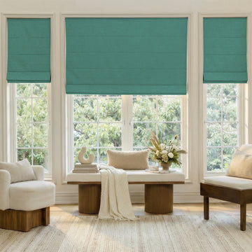 Alder Faux Linen Blackout Roman Shade in teal, custom fit.