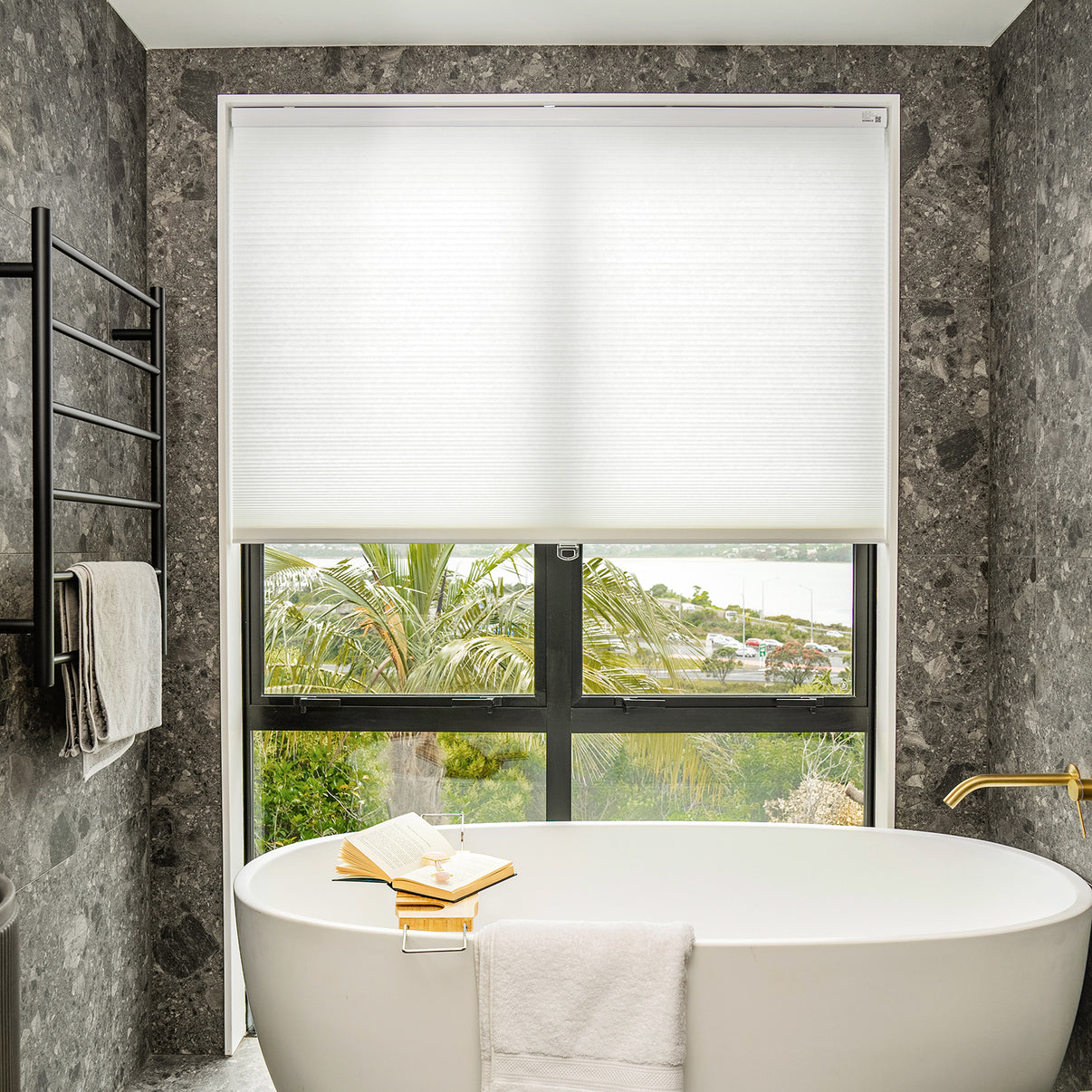 Solace Light Filtering Cellular Shade in white, controls soft light.
