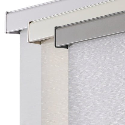 Three Free-Stop cordless blackout roller shades in white, cream, and gray with textured fabric and sleek aluminum valances.