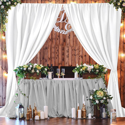 White polyester backdrop curtains draped elegantly for wedding reception. Ideal for parties and photography backdrops.