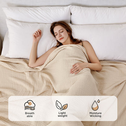 Woman sleeping under beige 4-layer muslin throw, featuring breathable, lightweight, moisture-wicking comfort.