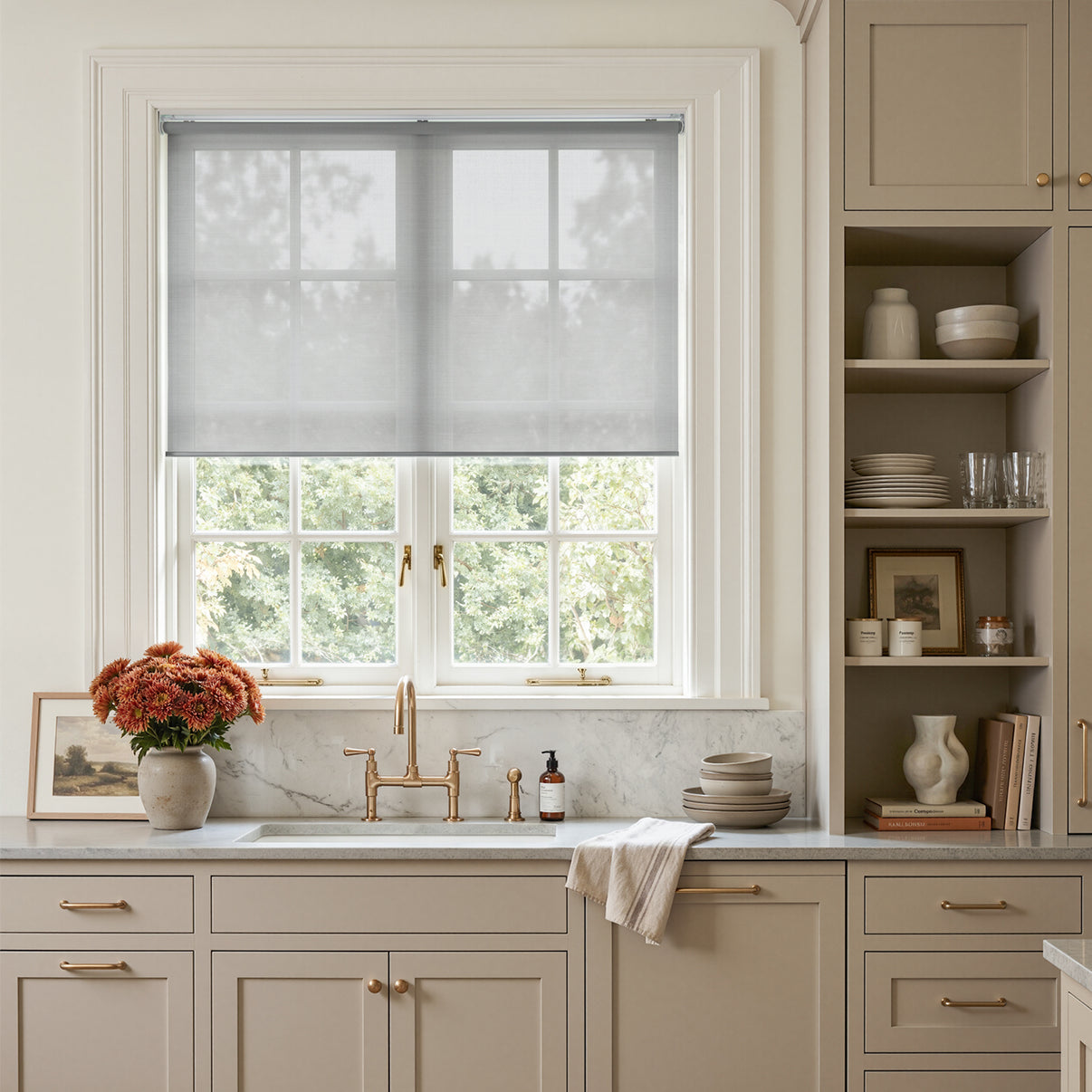 Joydeco Cove light filtering solar shade on a kitchen window, softening sunlight.