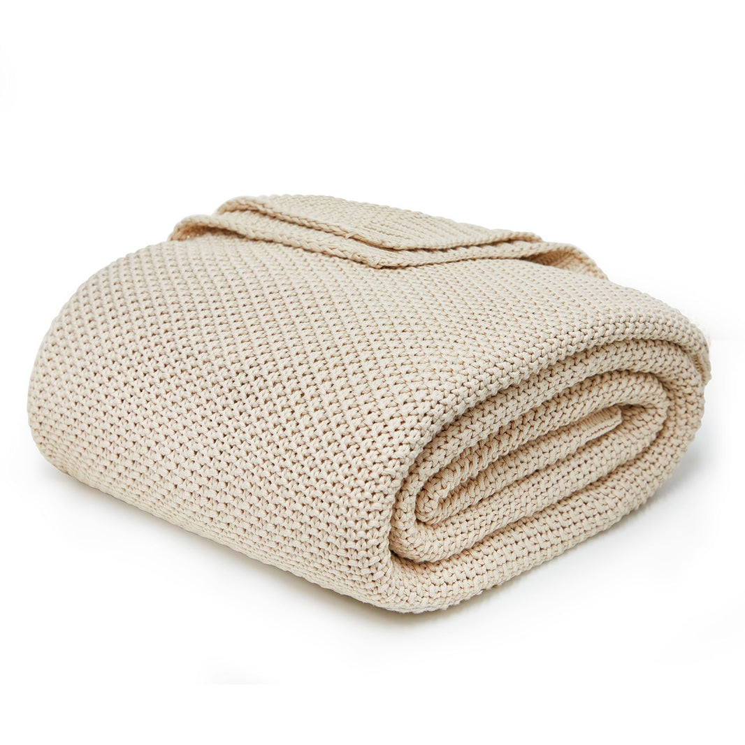 Olive green 100% cotton chunky cable knit throw blanket, soft, lightweight, for farmhouse couch or bed.