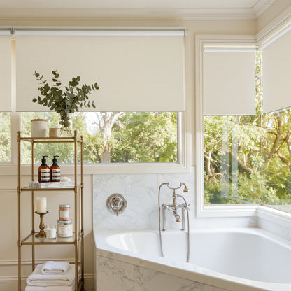 Ashby blackout roller shade in light cream, plain weave fabric.