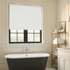 White Ashby blackout roller shade, minimalist matte plain weave fabric.
