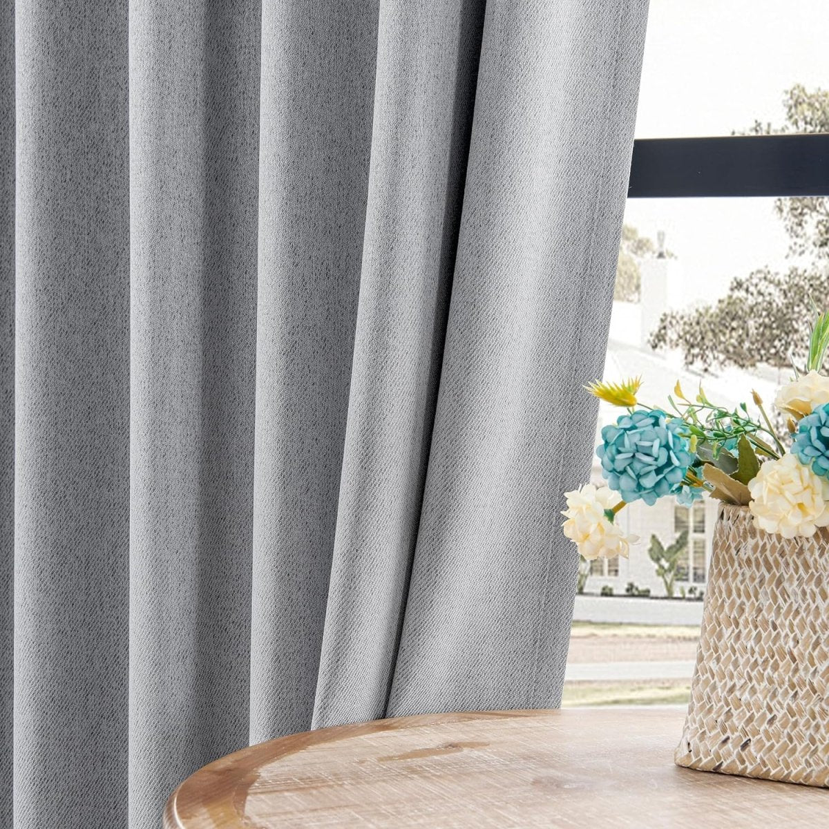 Light gray faux linen blackout curtains with textured weave, thermal insulated, for living room decor.