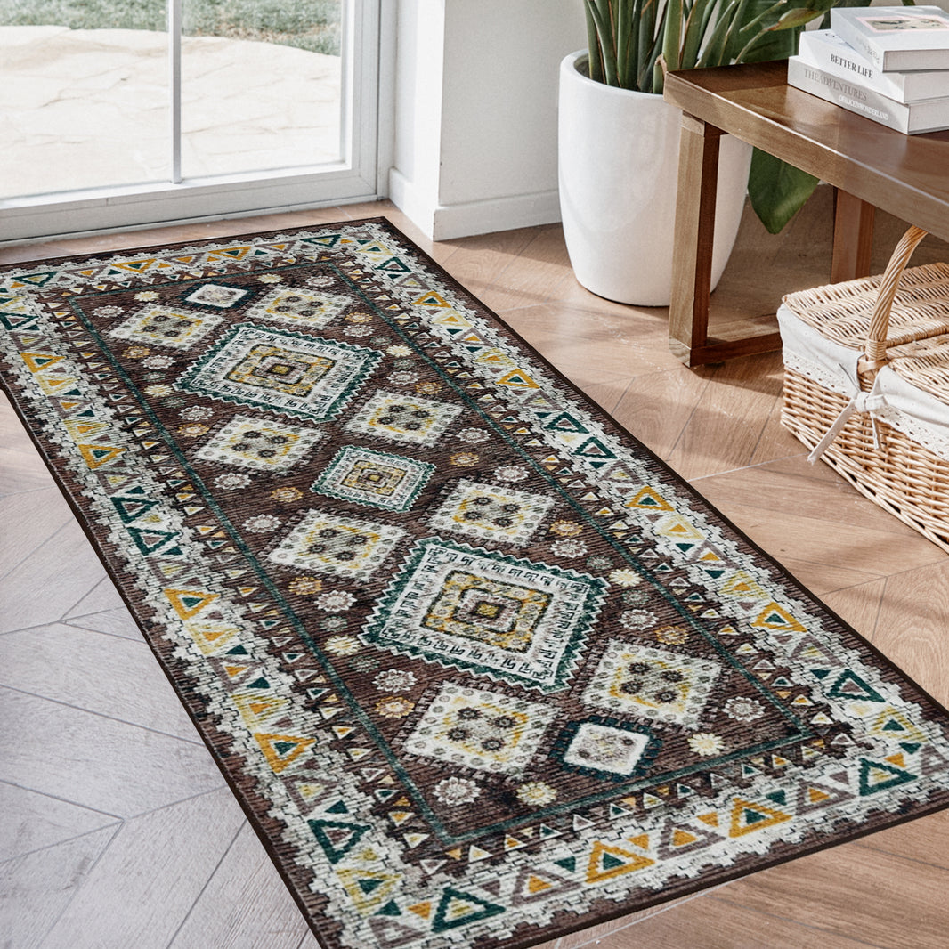 Joydeco vintage geometric runner rug, brown with yellow, white, teal diamond pattern, in entryway with wood floor.