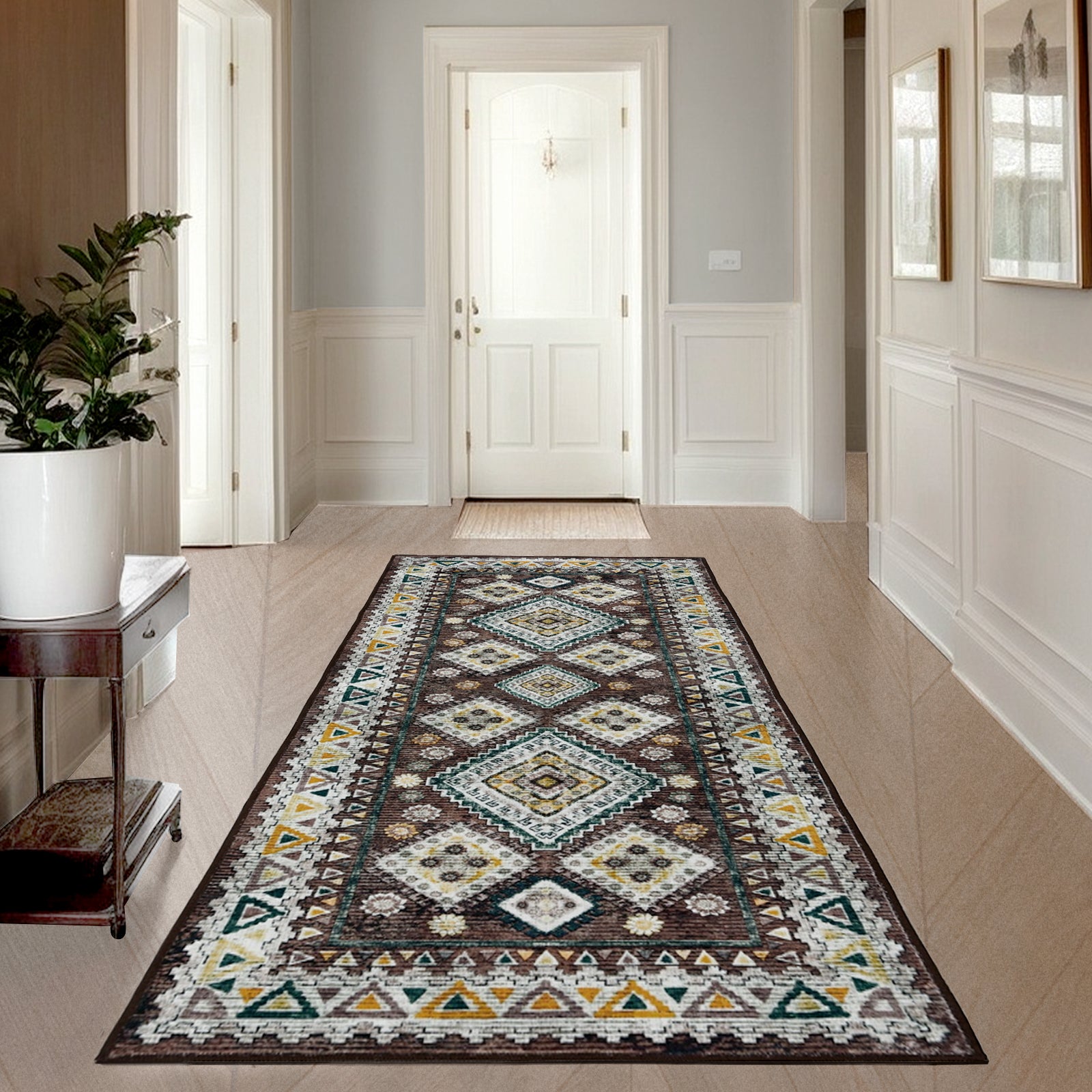 Joydeco brown, white, yellow, teal vintage geometric runner rug on light wood floor in entryway.