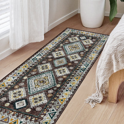Joydeco brown, white, yellow, teal vintage geometric runner rug on light wood floor in bedroom next to bed.