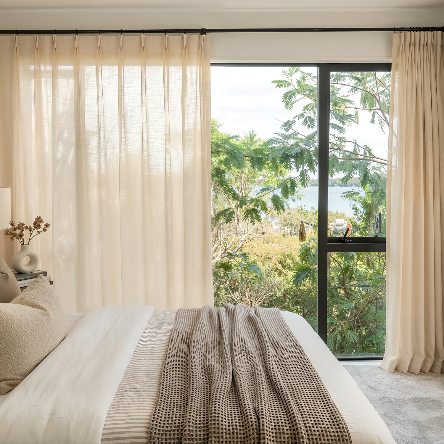 Sustainable custom Linden Linen Blend sheer curtains, soft beige, scenic view.