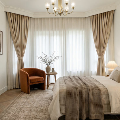 Beige chenille blackout curtains and sheer curtains creating elegant custom window treatments.
