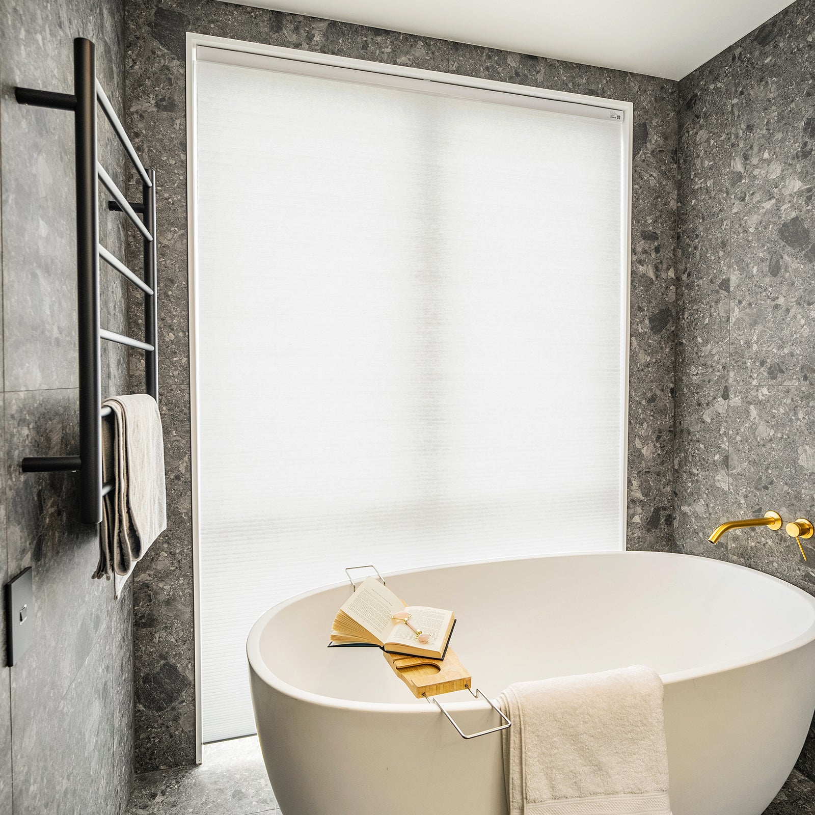 Solace Light Filtering Cellular Shade in white, softly filtering light for bathroom privacy.
