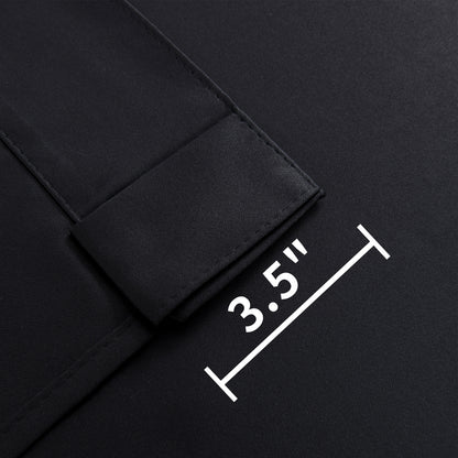 Close-up of Joydeco black blackout curtain fabric showing 3.5-inch back tab for hanging options.