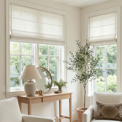 Custom Rowan light filtering Roman shade in natural slub linen blend.