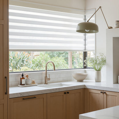 Marlow light filtering zebra shade with alternating sheer/solid bands for light control.