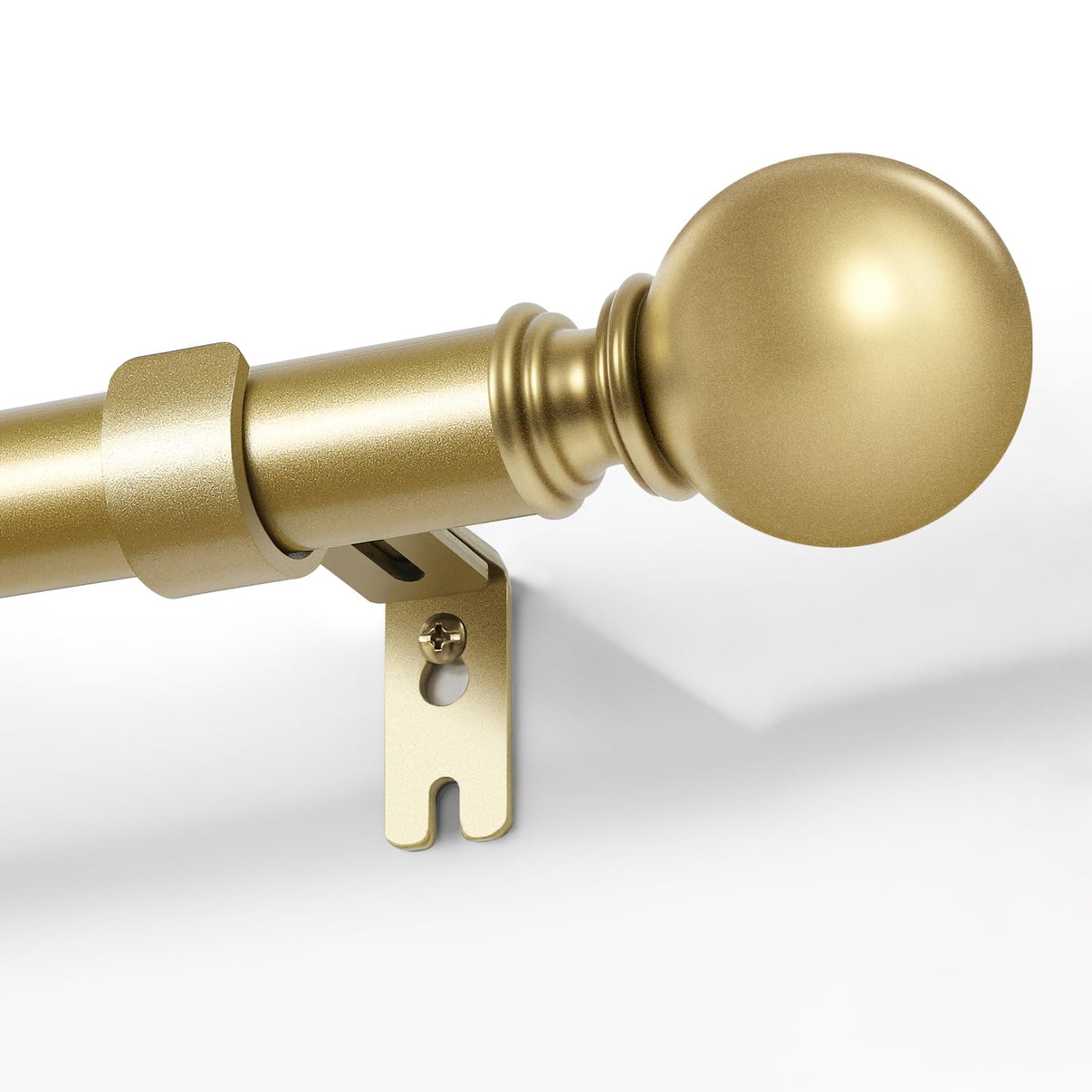 Gold adjustable curtain rod, 1-inch diameter, with spherical finial and bracket, mounted on white wall.