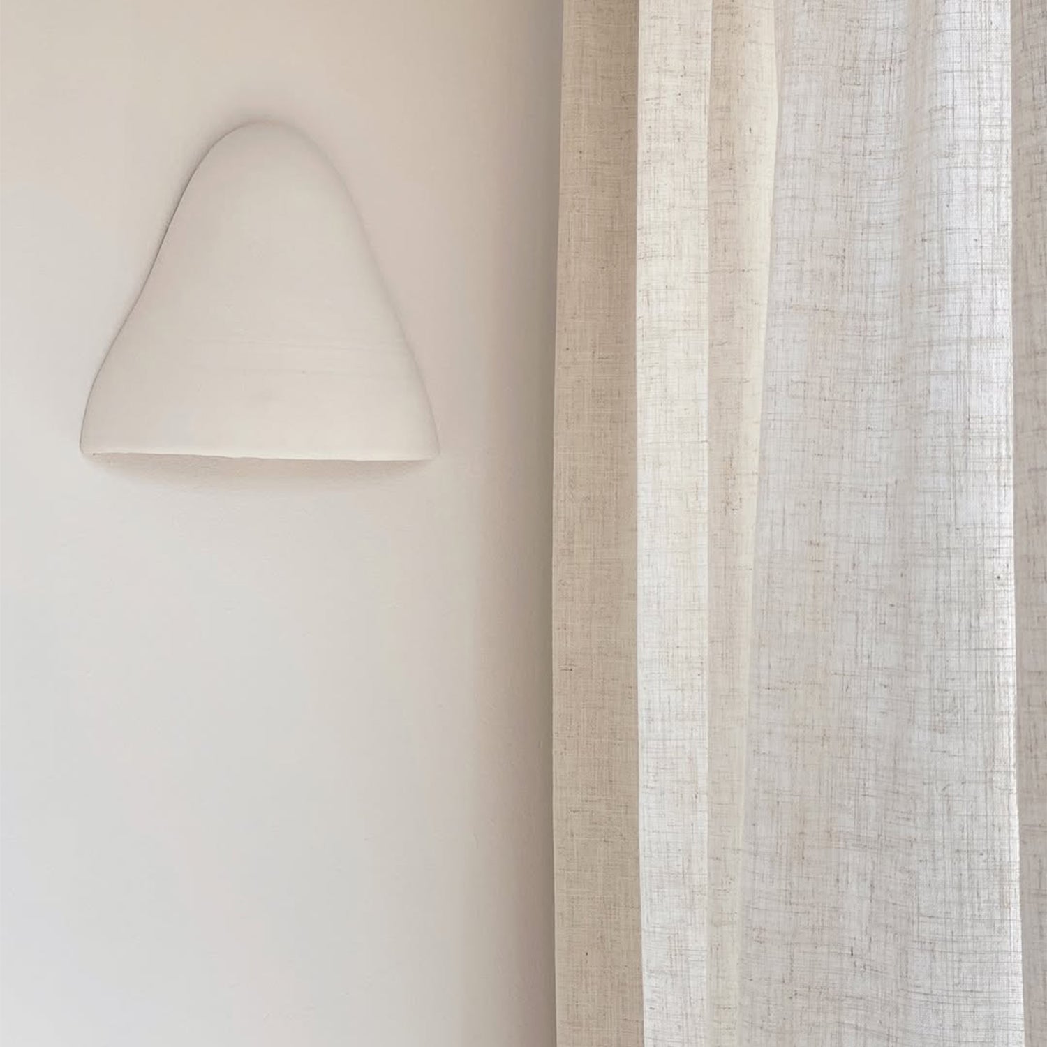 Joydeco pale cream linen blend semi-sheer curtain with visible texture, filtering light in a living room.