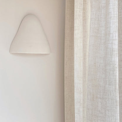 Joydeco pale cream linen blend semi-sheer curtain with visible texture, filtering light in a living room.