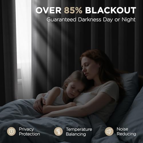 Joydeco charcoal grey blackout curtains block 85% light for peaceful sleep in bedroom with woman and child.