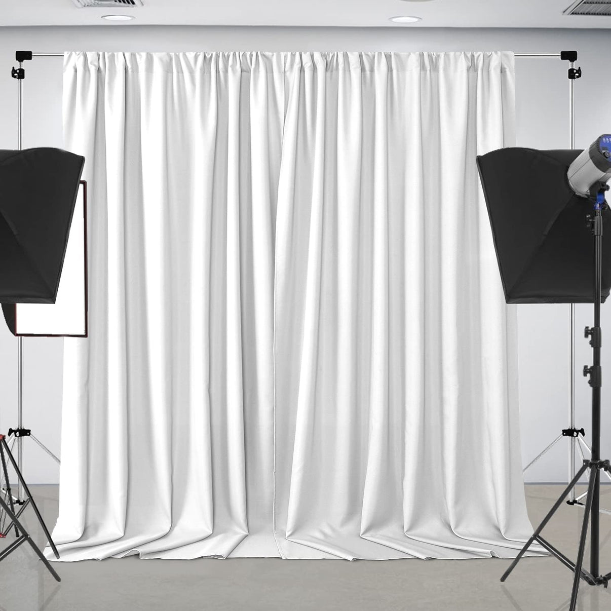 White polyester backdrop curtain, 10ft x 8ft, with elegant pleats. Ideal for parties, weddings, and photography studios.