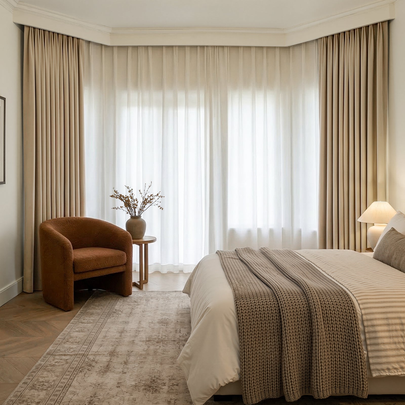 Beige chenille blackout curtains with sheer curtains in a bedroom.