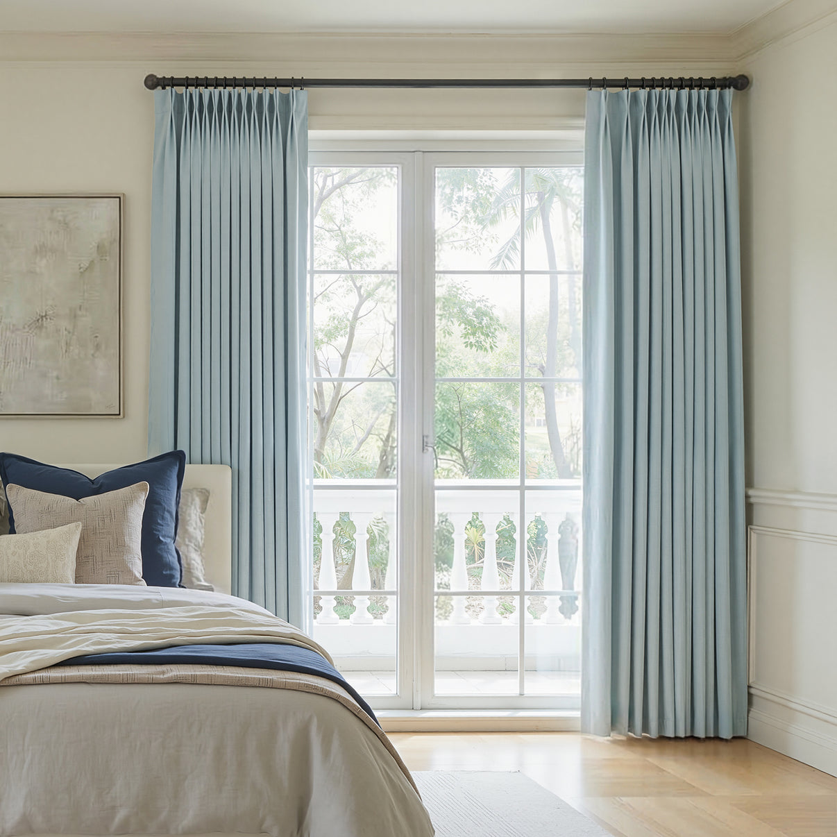 Custom Hayden light blue chenille blackout curtain with pinch pleats.