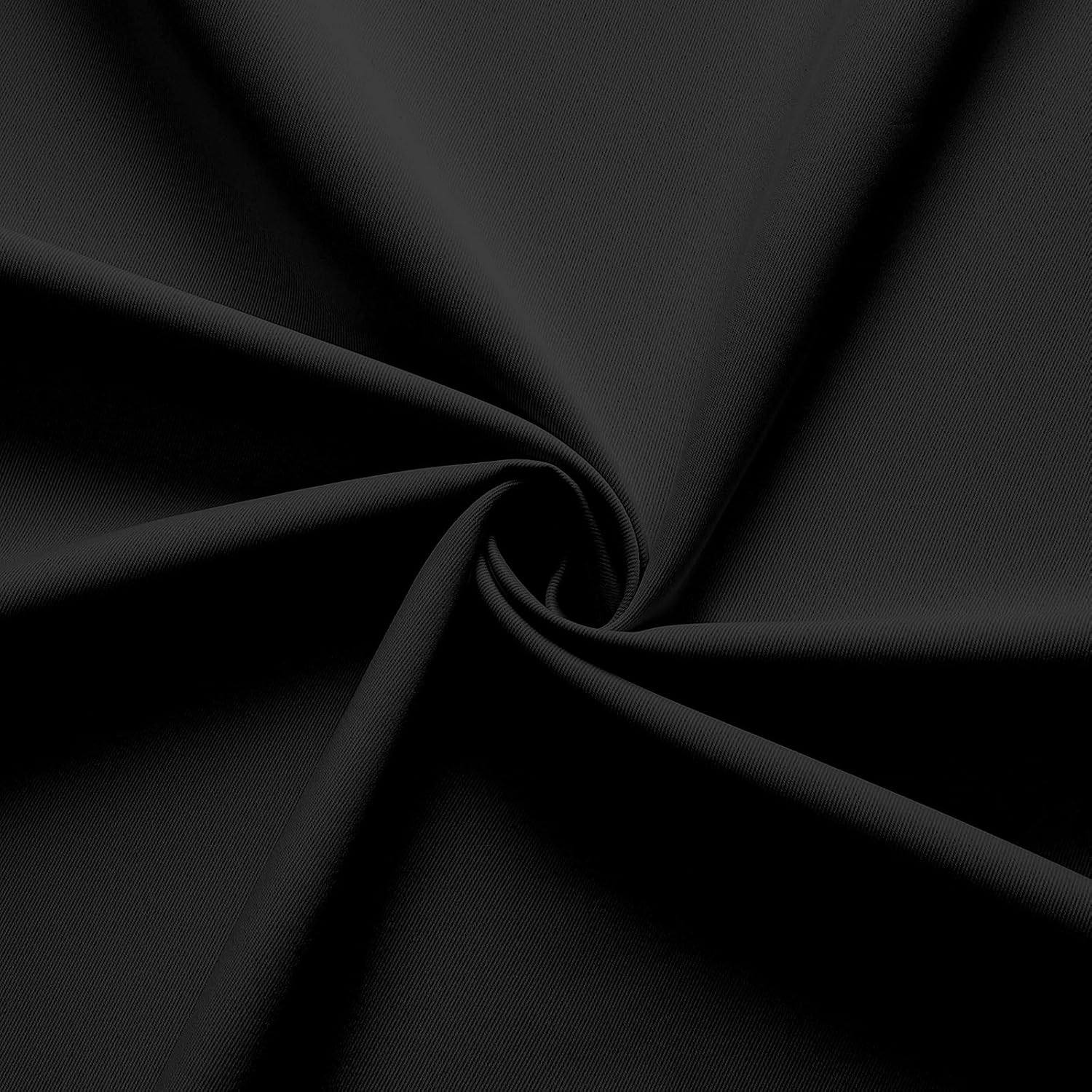Close-up of dense matte black polyester fabric texture, showcasing tight weave for Joydeco blackout curtains.