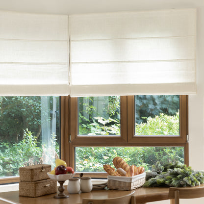 Rowan light filtering linen Roman shade with slub texture, enhancing natural light and privacy.