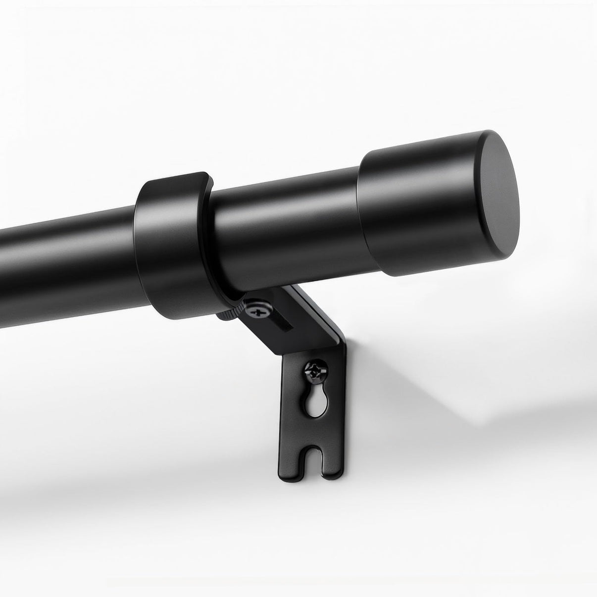 Joydeco matte black adjustable 1-inch diameter heavy duty window curtain rod, mounted with bracket and finial.