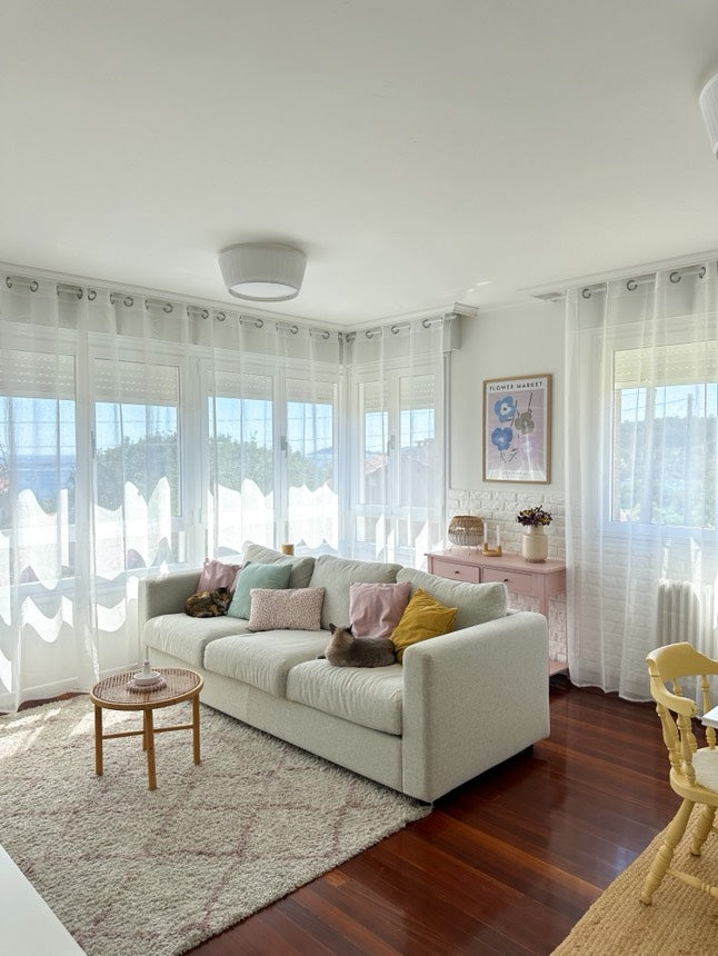 Joydeco white sheer curtains with rod pocket in a bright living room, filtering sunlight onto a beige sofa with cats.