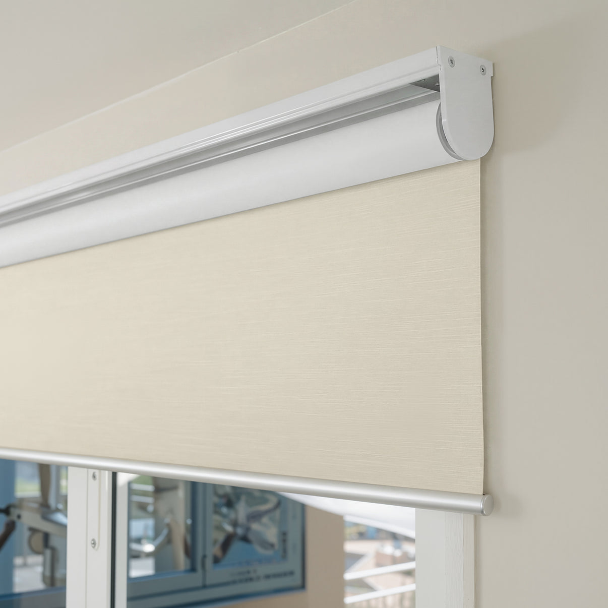 Cream Ashby blackout roller shade, plain weave fabric, 100% blackout.