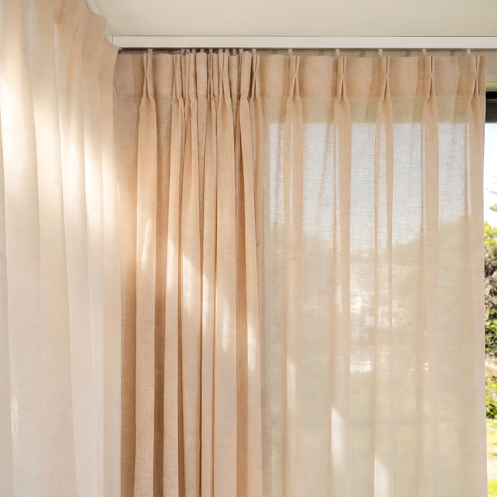Light beige Willow linen-blend curtain panel, softly filtering light and showing its sheer, textured weave.