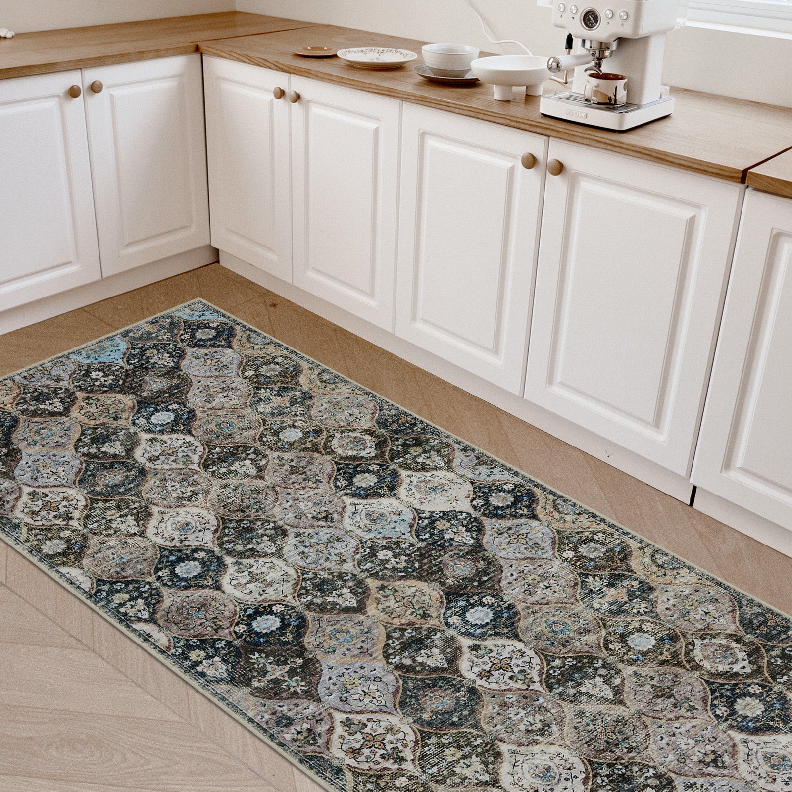 Joydeco vintage distressed floral runner rug in teal, beige, and grey, low pile, in a modern kitchen.