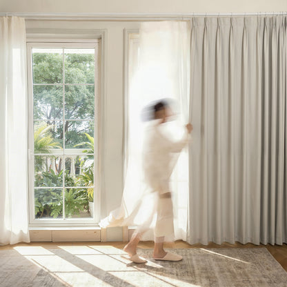 Joydeco light grey custom satin blackout curtain with deep pleats.