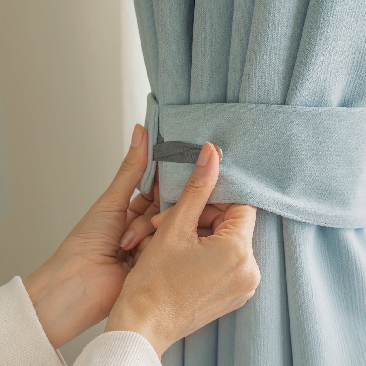 Hayden custom light blue chenille blackout window treatment tie-back.