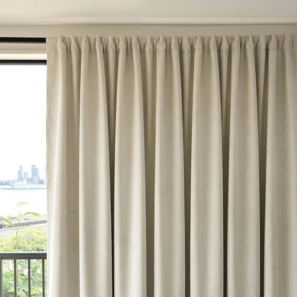 Beige Everly heavyweight chenille room darkening curtain, pleated top, offering light blocking.