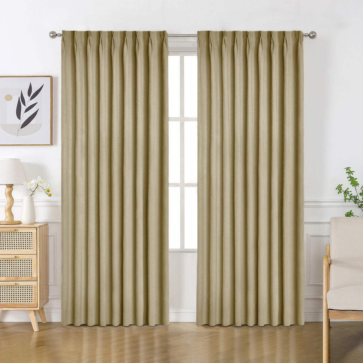 Beige velourette chenille blackout drapes with pinch pleat tops, shown in a room setting with wooden furniture.
