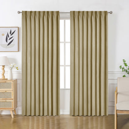 Beige velourette chenille blackout drapes with pinch pleat tops, shown in a room setting with wooden furniture.