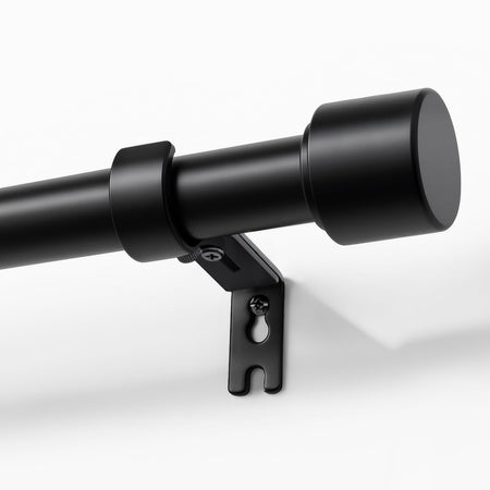 Joydeco modern black adjustable curtain rod, 1 inch diameter, with sleek finial and heavy-duty bracket shown mounted on wall.