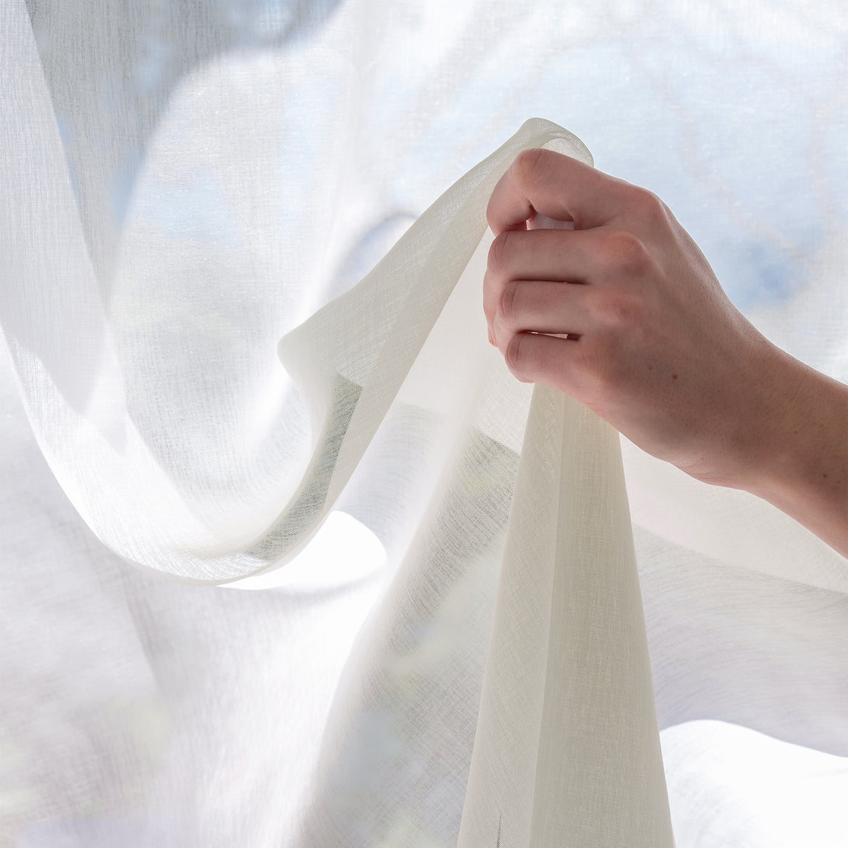 Feather custom lightweight sheer curtain fabric in soft white Dori polyester.