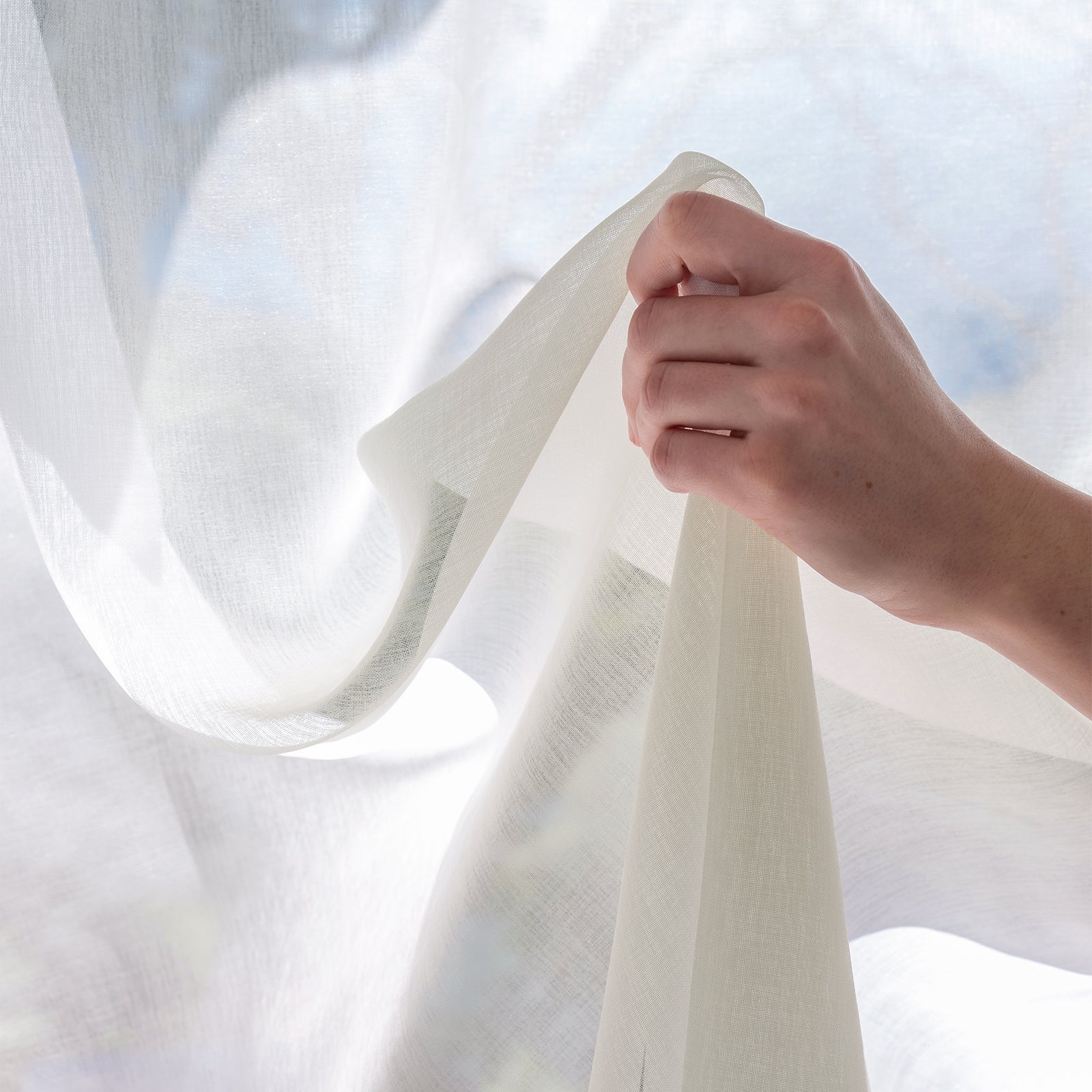 Feather custom lightweight sheer curtain fabric in soft white Dori polyester.