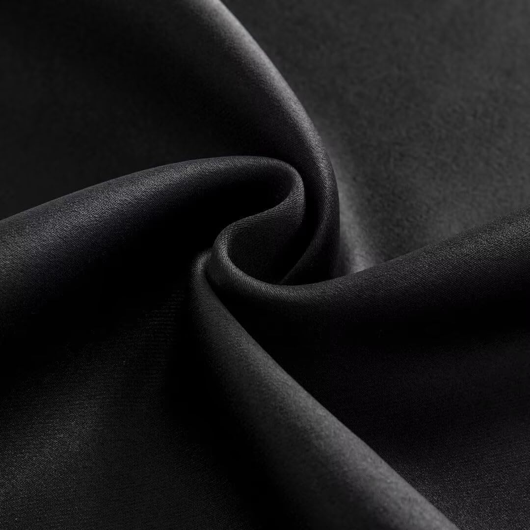 Close-up of black polyester blackout curtain fabric, showcasing dense, matte texture and smooth finish.