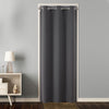 Charcoal gray extra wide blackout curtain with grommets used as a room divider for a doorway.