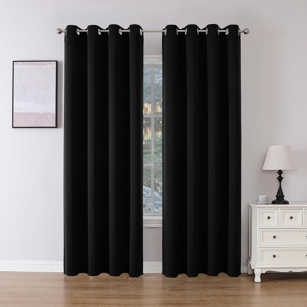 Joydeco Black Grommet Blackout Curtains, 84 inch length, two panels shown in a bedroom window context.