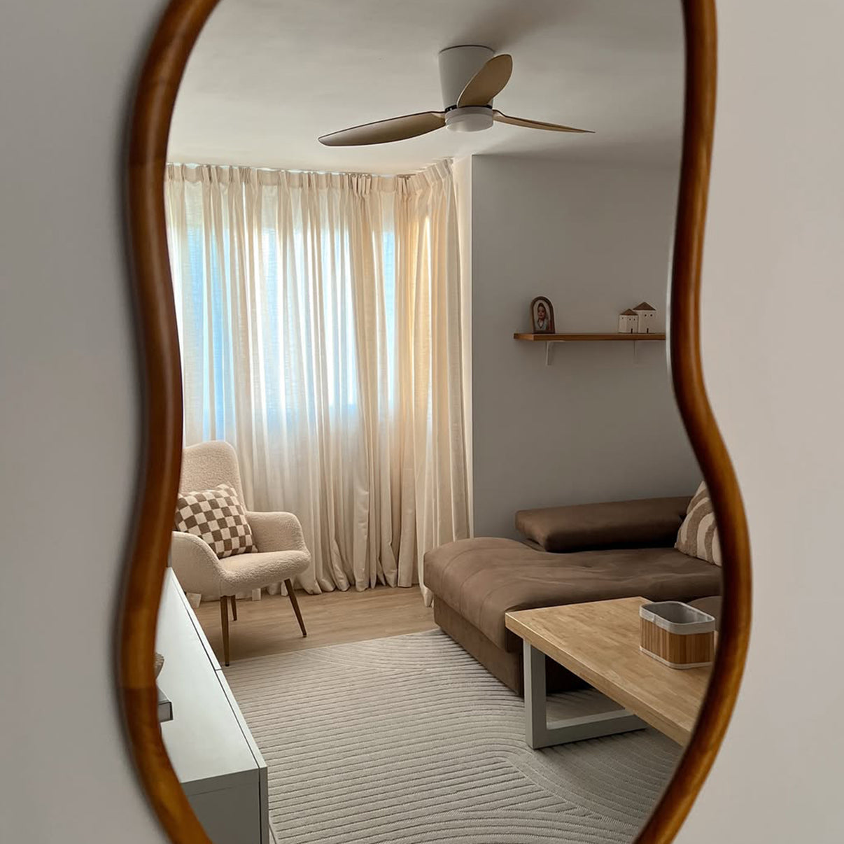 Joydeco off-white semi-sheer linen curtains filtering light in a living room with armchair and sofa.