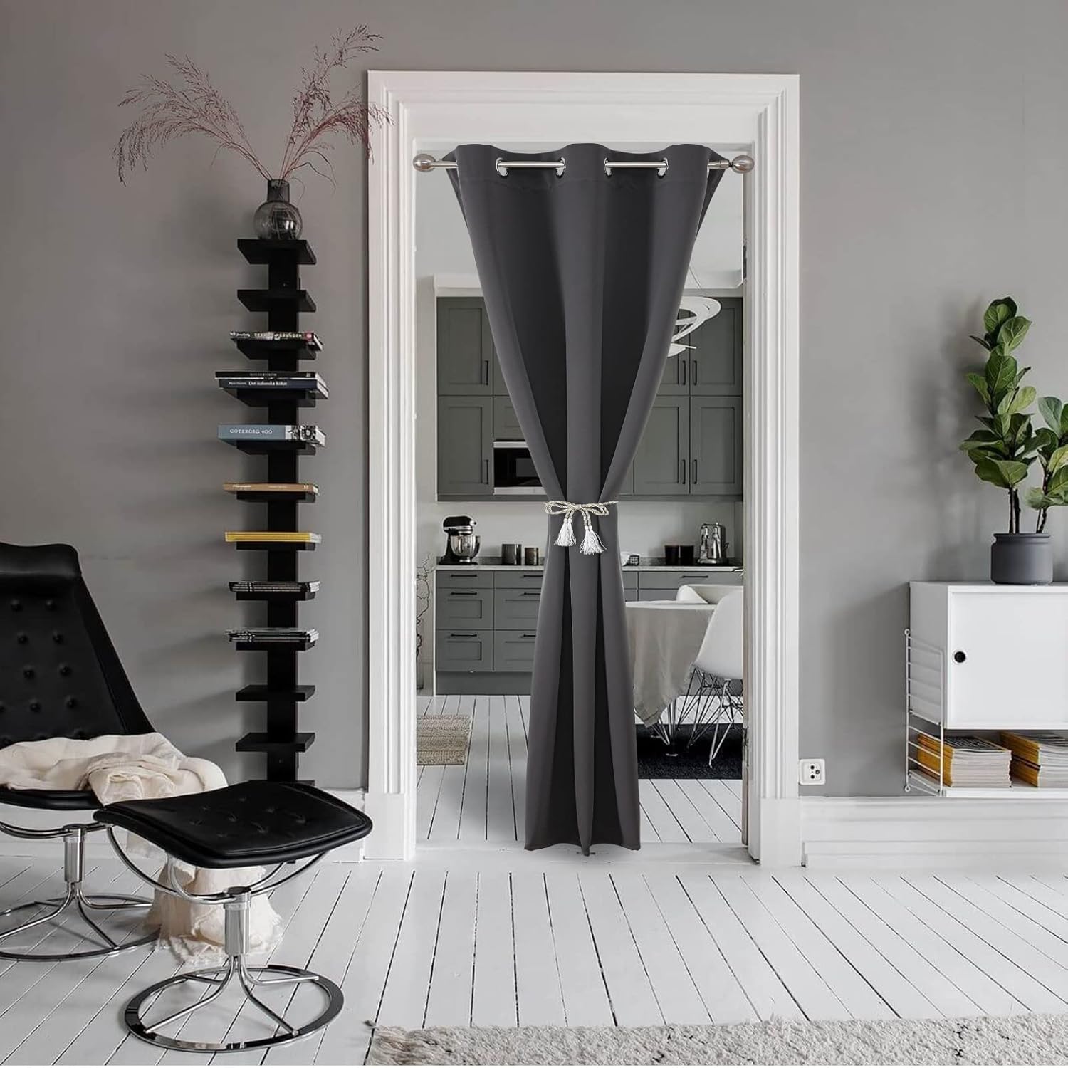 Grey blackout door curtain with silver grommets used as room divider.