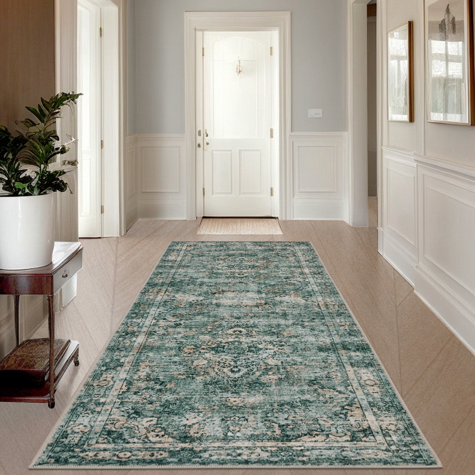 Joydeco distressed floral runner rug in teal with a low pile, displayed in a hallway.