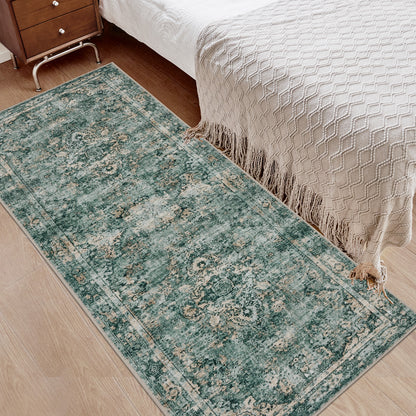 Joydeco teal distressed floral runner rug, low pile, next to bed with beige throw on wood floor.